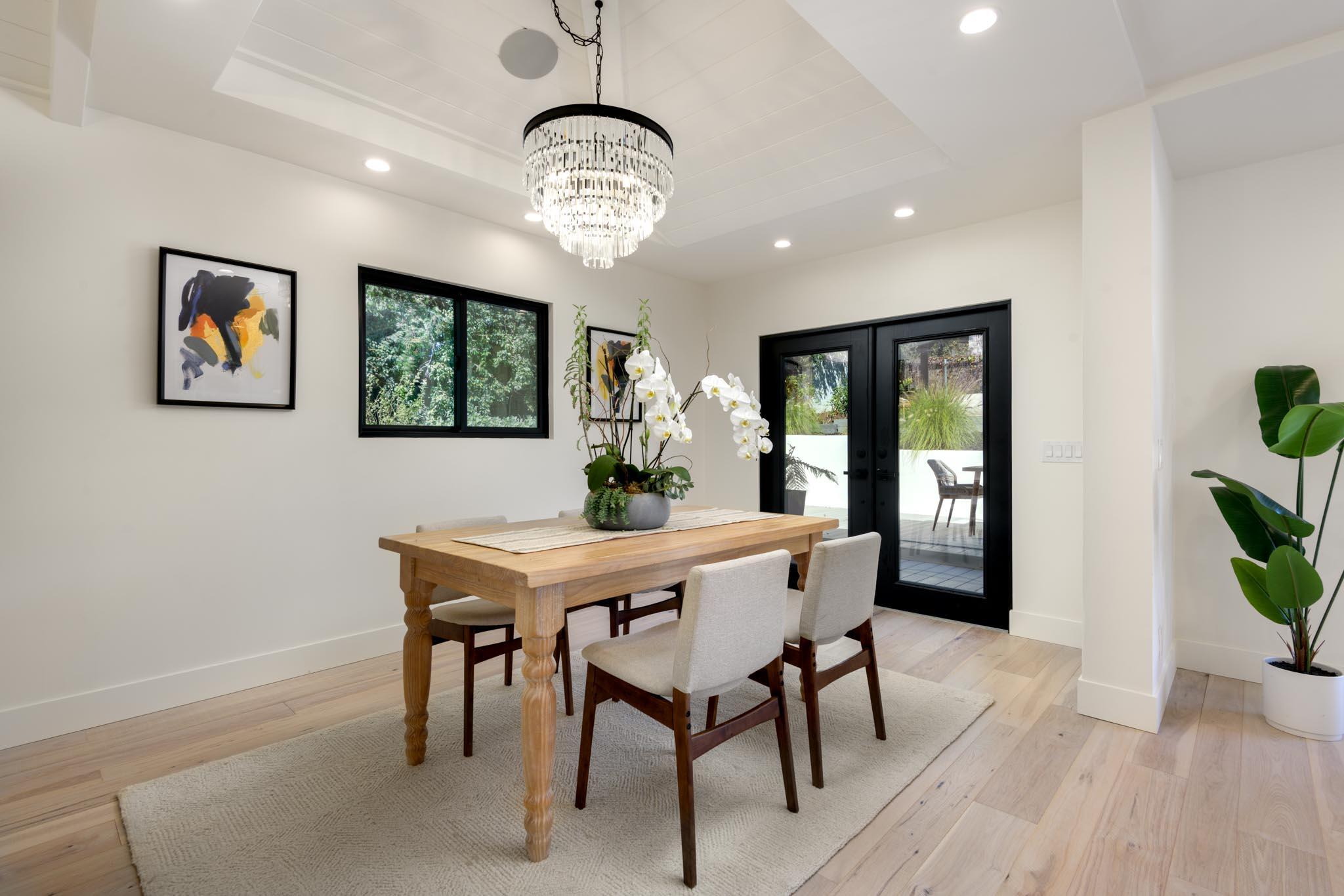 3816 Sunset Road Santa Barbara, CA 93110 - Photo 10 of 38 a view of a dining room with furniture window and wooden floor