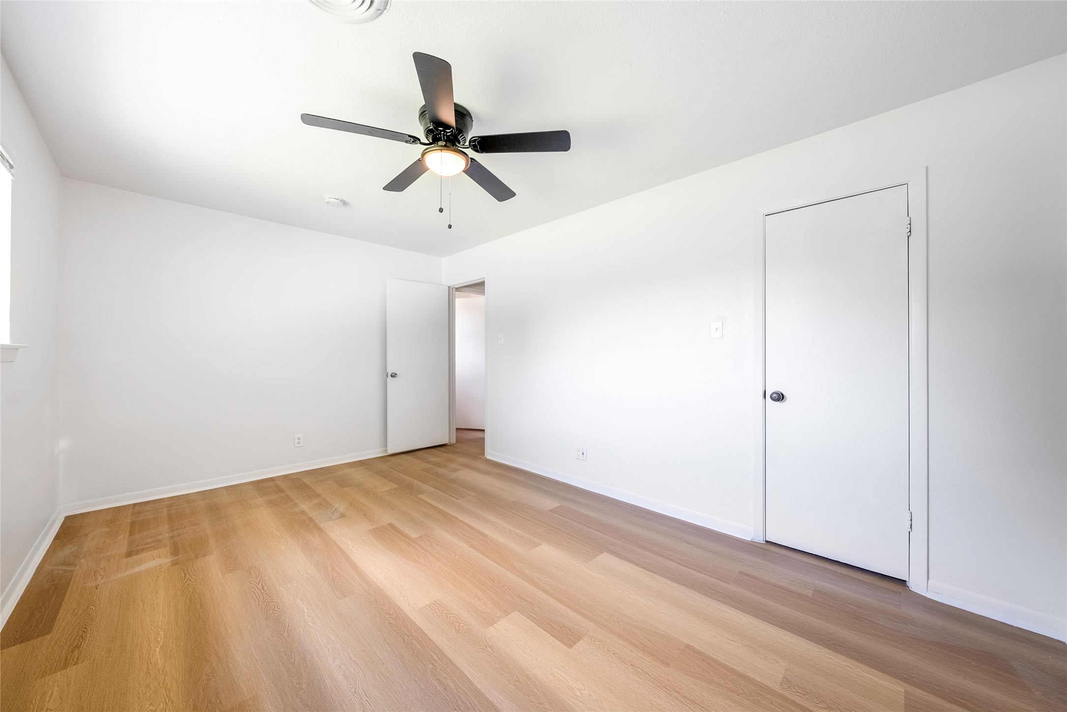 807 Country Club Road Georgetown, TX 78628 - Photo 19 of 28 a view of a big room with wooden floor and windows in a room