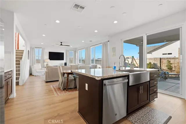 a view of a bedroom with wooden floor and windows