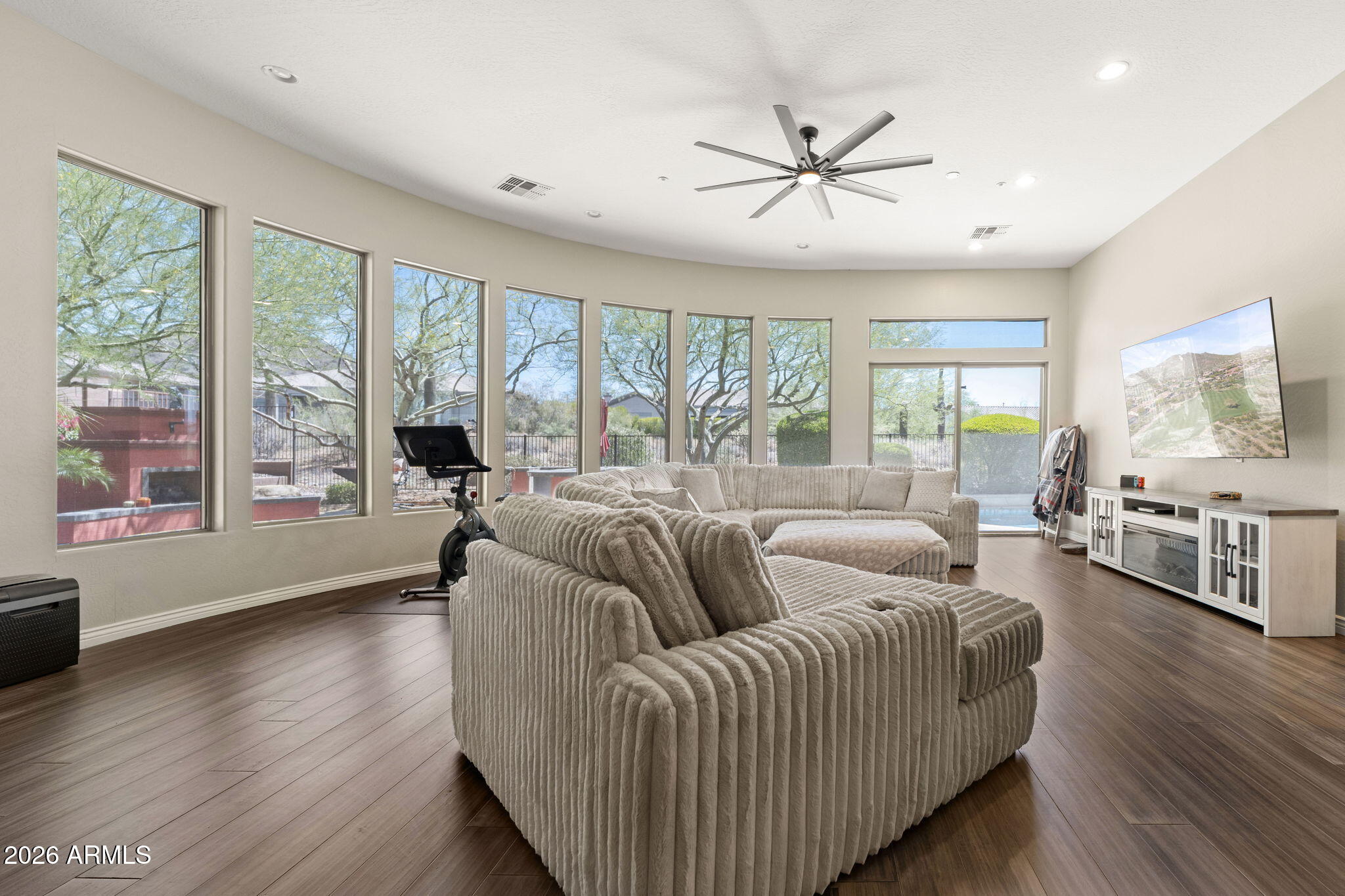 41619 North River Bend Road Anthem, AZ 85086 - Photo 43 of 84 a living room with furniture and a large window with wooden floor