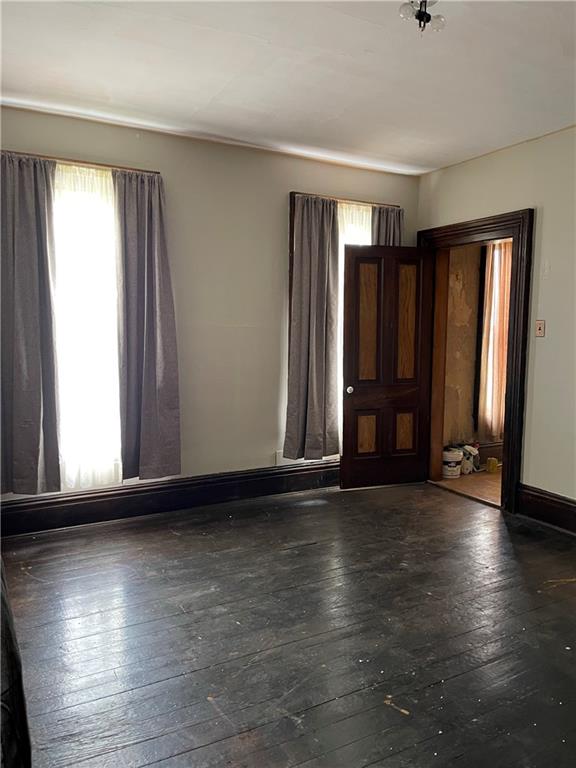 4574 Prosperity Pike Prosperity, PA 15329 - Photo 15 of 23 an empty room with wooden floor and windows