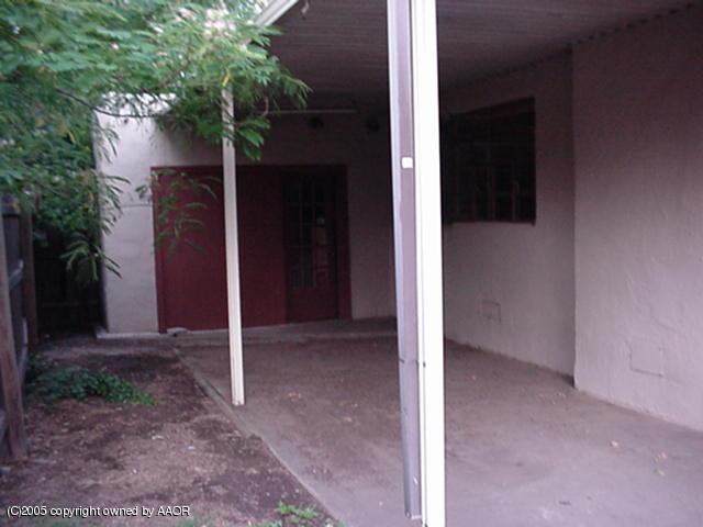 1225 South Rusk Street Amarillo, TX 79102 - Photo 9 of 15 One car garage and a carport