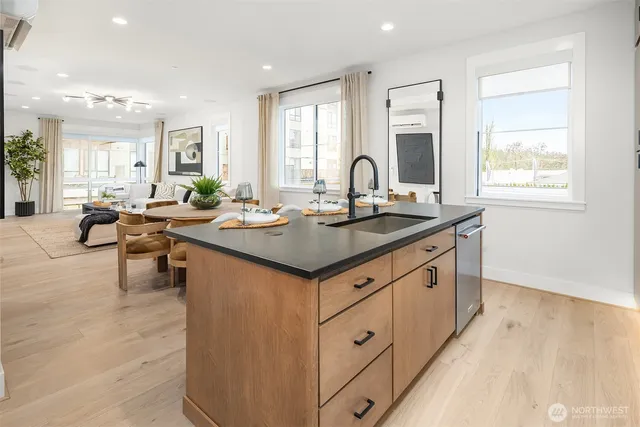 a kitchen with a stove a sink and a refrigerator