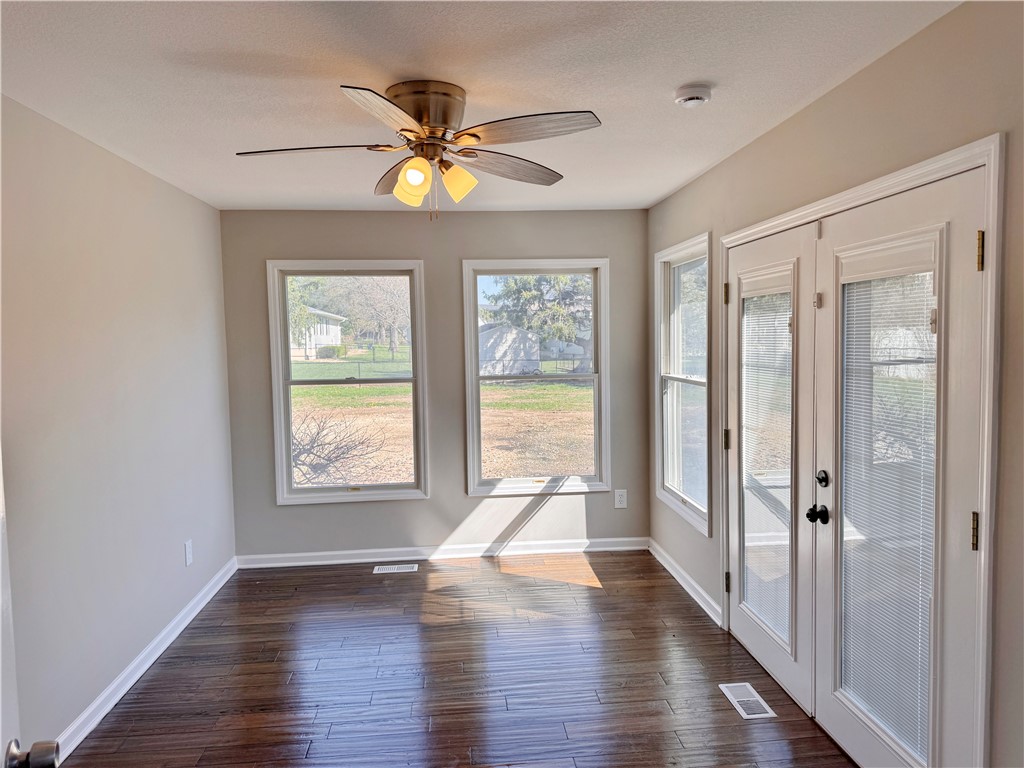 1118 Wedgewood Court Decatur, IL 62526 - Photo 12 of 22 a view of an empty room with wooden floor and a window