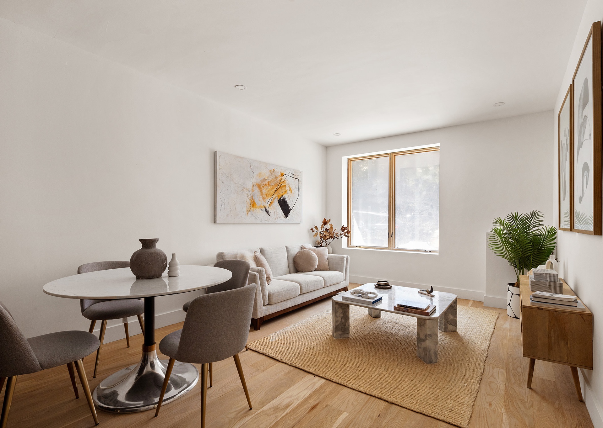 197 Pulaski Street, Unit PH Brooklyn, NY 11206 - Photo 2 of 8 a living room with furniture and a potted plant