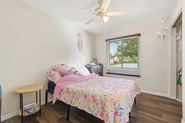 a bathroom with a sink a toilet a mirror a bathtub and shower