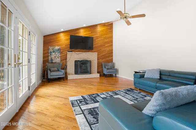 a bedroom with furniture and a fireplace