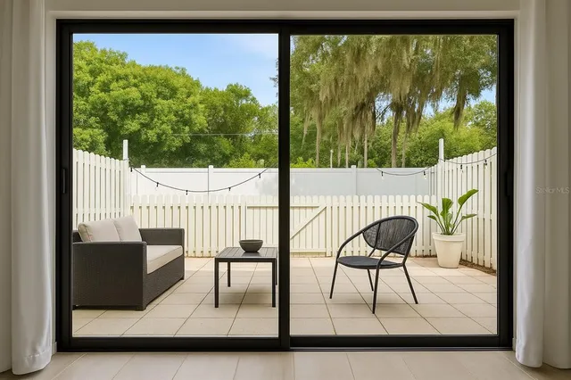a view of a floor to ceiling window and an outdoor view