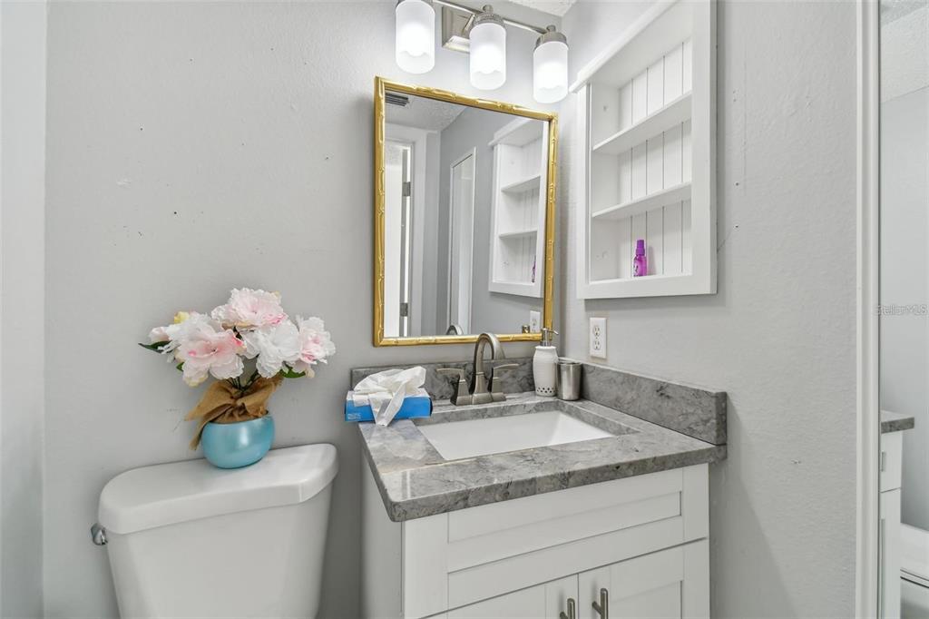 4427 Dylan Loop, Unit 190 Land O' Lakes, FL 34639 - Photo 14 of 26 a bathroom with a sink a vanity and a mirror