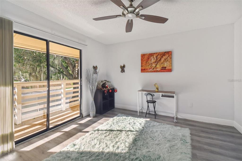 4427 Dylan Loop, Unit 190 Land O' Lakes, FL 34639 - Photo 17 of 26 a bedroom with furniture and a window