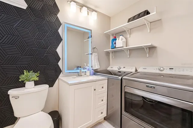 a kitchen with a stove cabinets and a sink