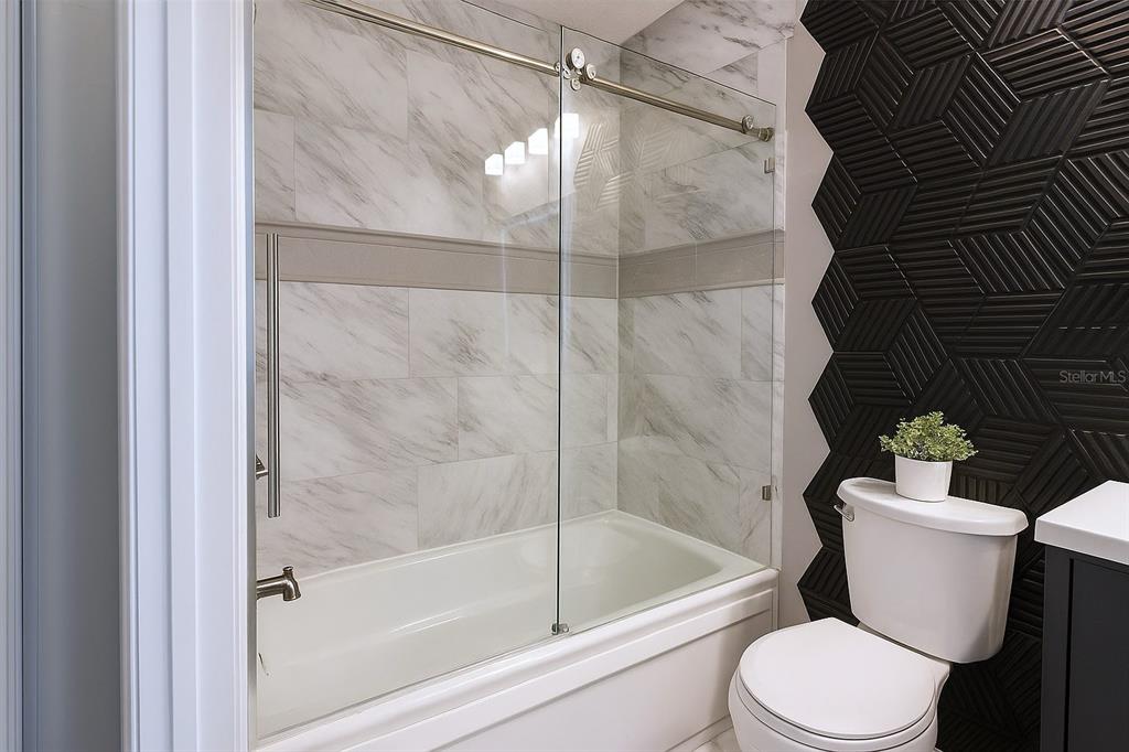 4427 Dylan Loop, Unit 190 Land O' Lakes, FL 34639 - Photo 22 of 26 a white toilet sitting next to a bath tub