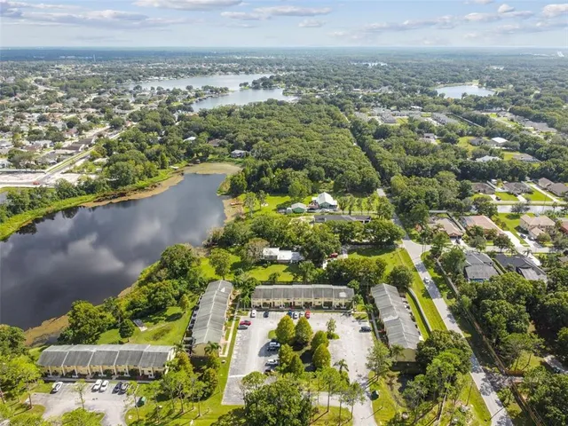 an aerial view of residential houses with outdoor space