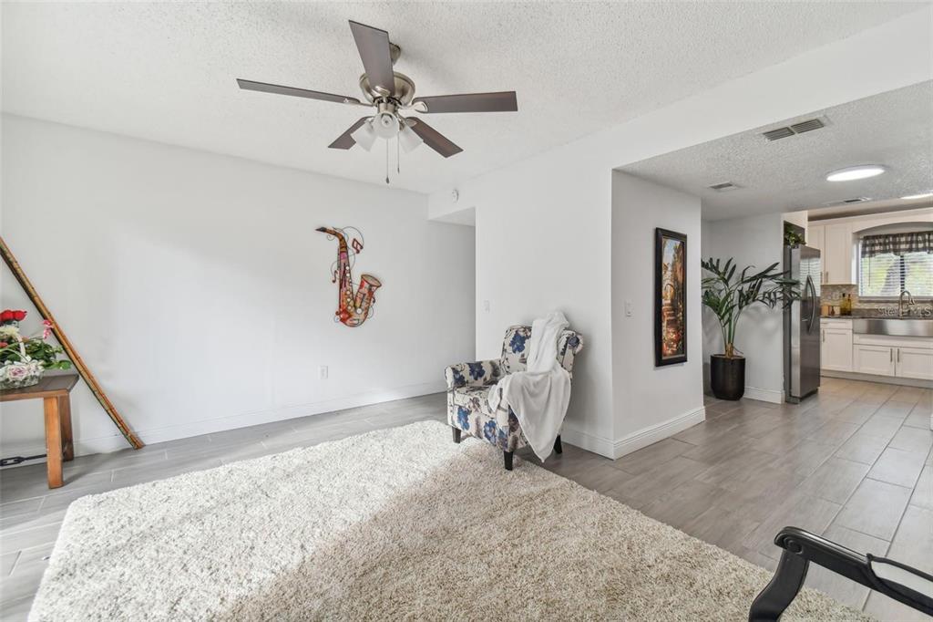4427 Dylan Loop, Unit 190 Land O' Lakes, FL 34639 - Photo 3 of 26 a view of a livingroom with furniture and a ceiling fan