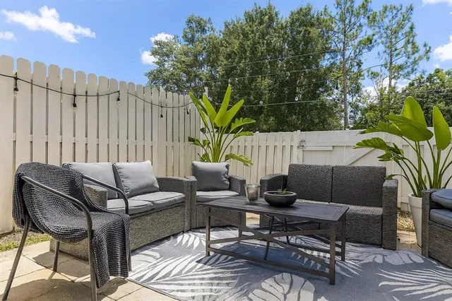 a outdoor living space with furniture and a potted plant