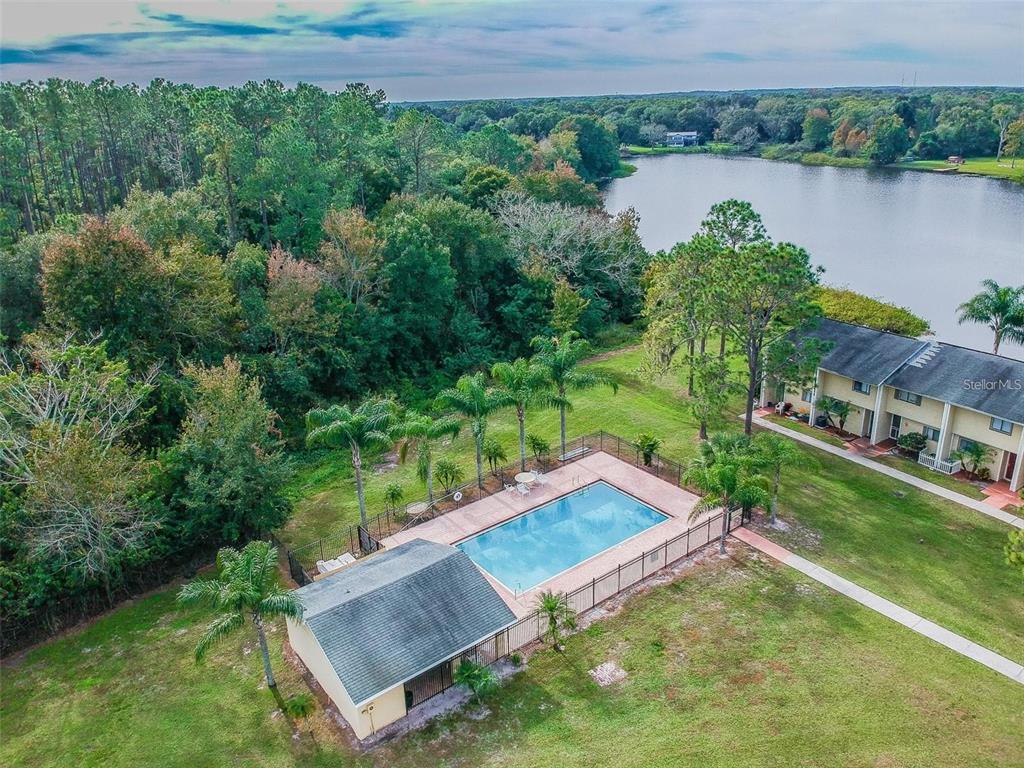 4427 Dylan Loop, Unit 190 Land O' Lakes, FL 34639 - Photo 5 of 26 an aerial view of a house with a yard and lake view