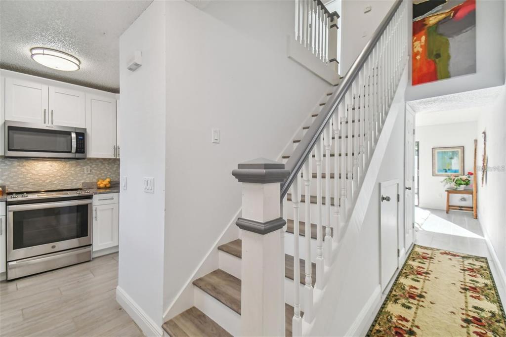 4427 Dylan Loop, Unit 190 Land O' Lakes, FL 34639 - Photo 6 of 26 a view of entryway and hall with wooden floor