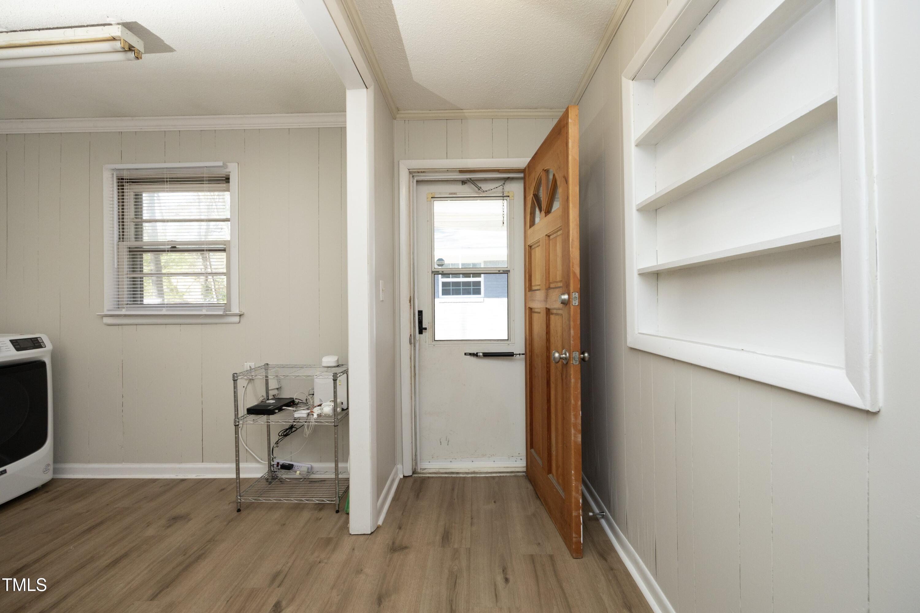 608 Cecil Street Durham, NC 27707 - Photo 17 of 31 a view of a livingroom with wooden floor and a window
