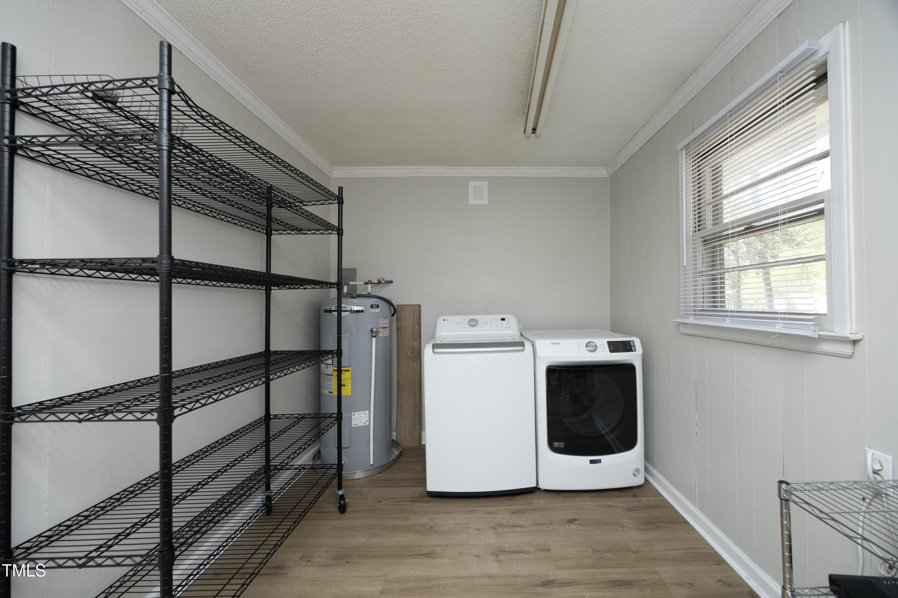 608 Cecil Street Durham, NC 27707 - Photo 18 of 31 a utility room with dryer and washer