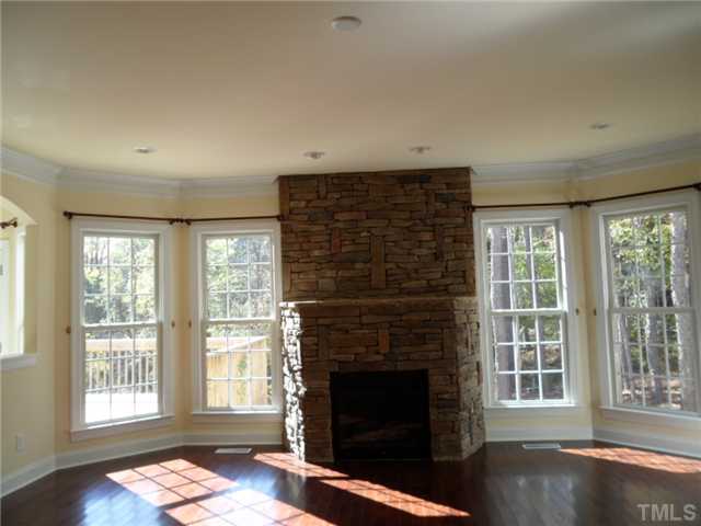 2037 Macon Ridge Road Raleigh, NC 27613 - Photo 10 of 25 a living room with furniture and a fireplace