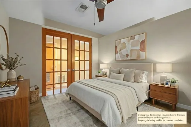 a spacious bedroom with a bed next to a large window