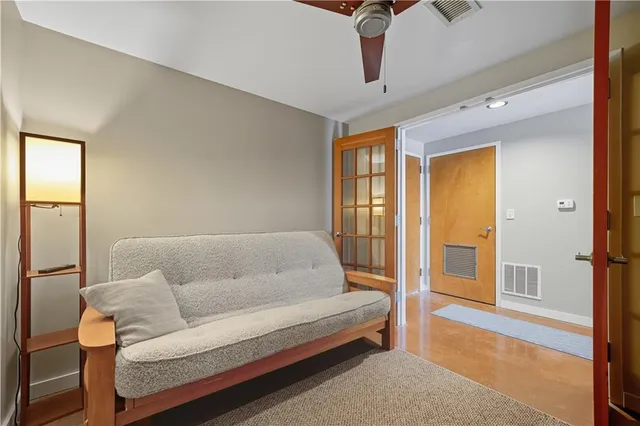 a living room with furniture and a rug