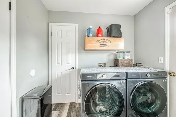 a bathroom with a granite countertop sink a toilet and bathtub