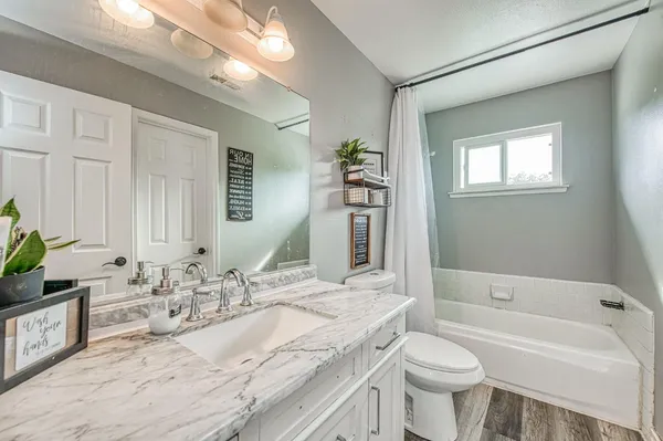 a bed room with a bed and a window