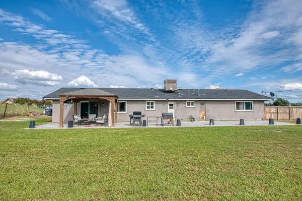 a view of outdoor space with deck and yard