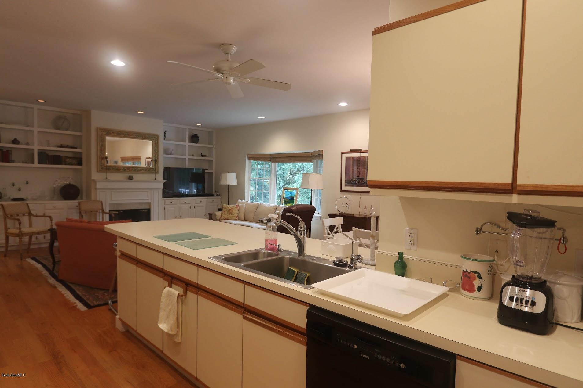 11 Prospect Hill Road, Unit 2 Stockbridge, MA 01262 - Photo 11 of 53 a kitchen with stainless steel appliances granite countertop a sink a stove and a refrigerator