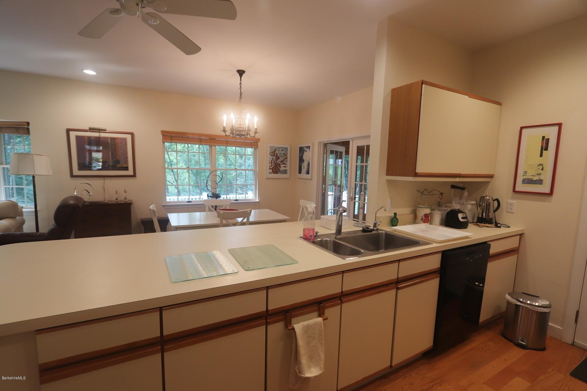 11 Prospect Hill Road, Unit 2 Stockbridge, MA 01262 - Photo 14 of 53 a kitchen with a sink and a stove top oven