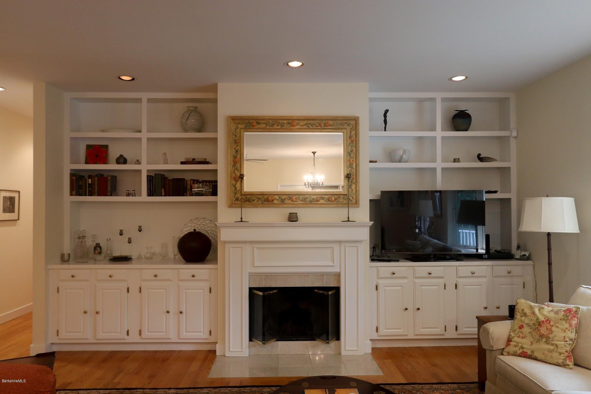 11 Prospect Hill Road, Unit 2 Stockbridge, MA 01262 - Photo 3 of 53 a living room with furniture and a fireplace