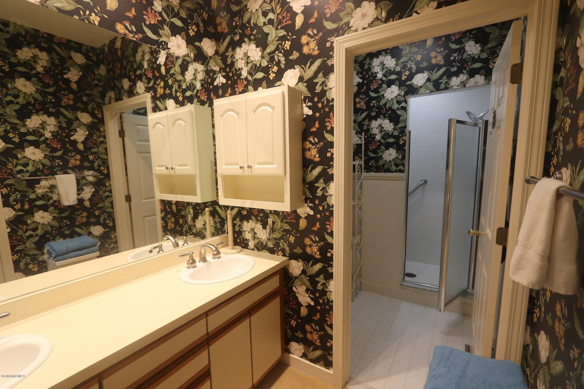 11 Prospect Hill Road, Unit 2 Stockbridge, MA 01262 - Photo 22 of 53 a bathroom with a sink and a mirror