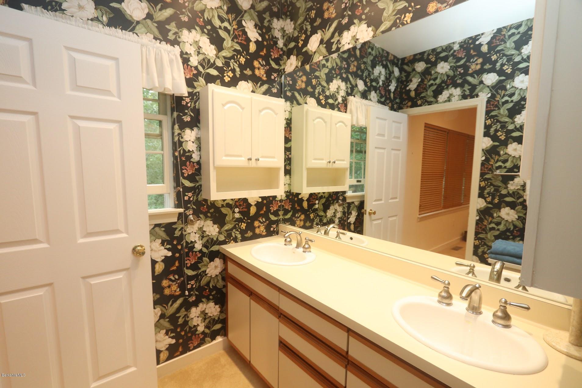 11 Prospect Hill Road, Unit 2 Stockbridge, MA 01262 - Photo 23 of 53 a bathroom with a sink and a mirror
