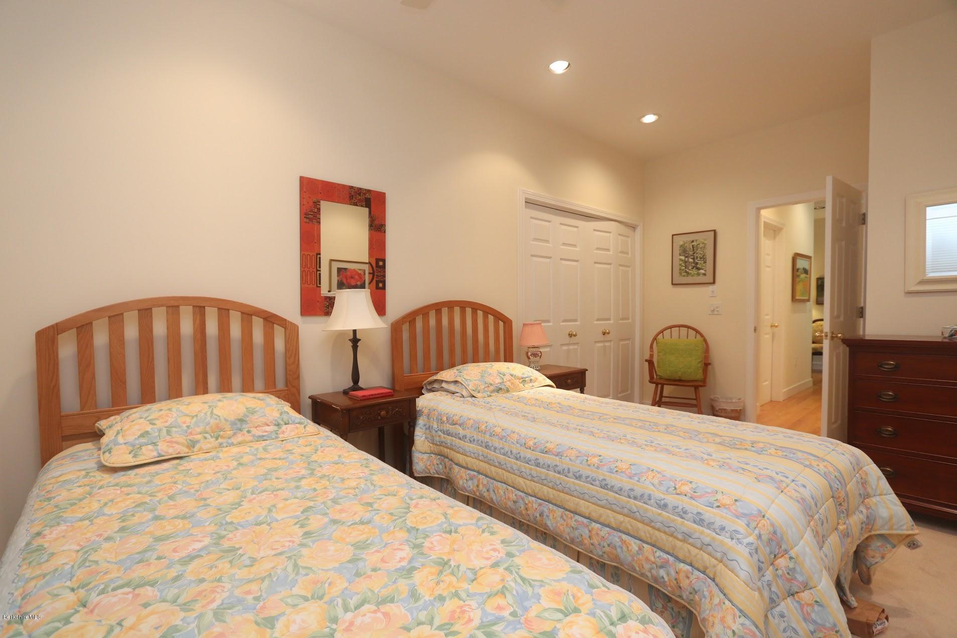11 Prospect Hill Road, Unit 2 Stockbridge, MA 01262 - Photo 25 of 53 a bedroom with two beds and a lamp
