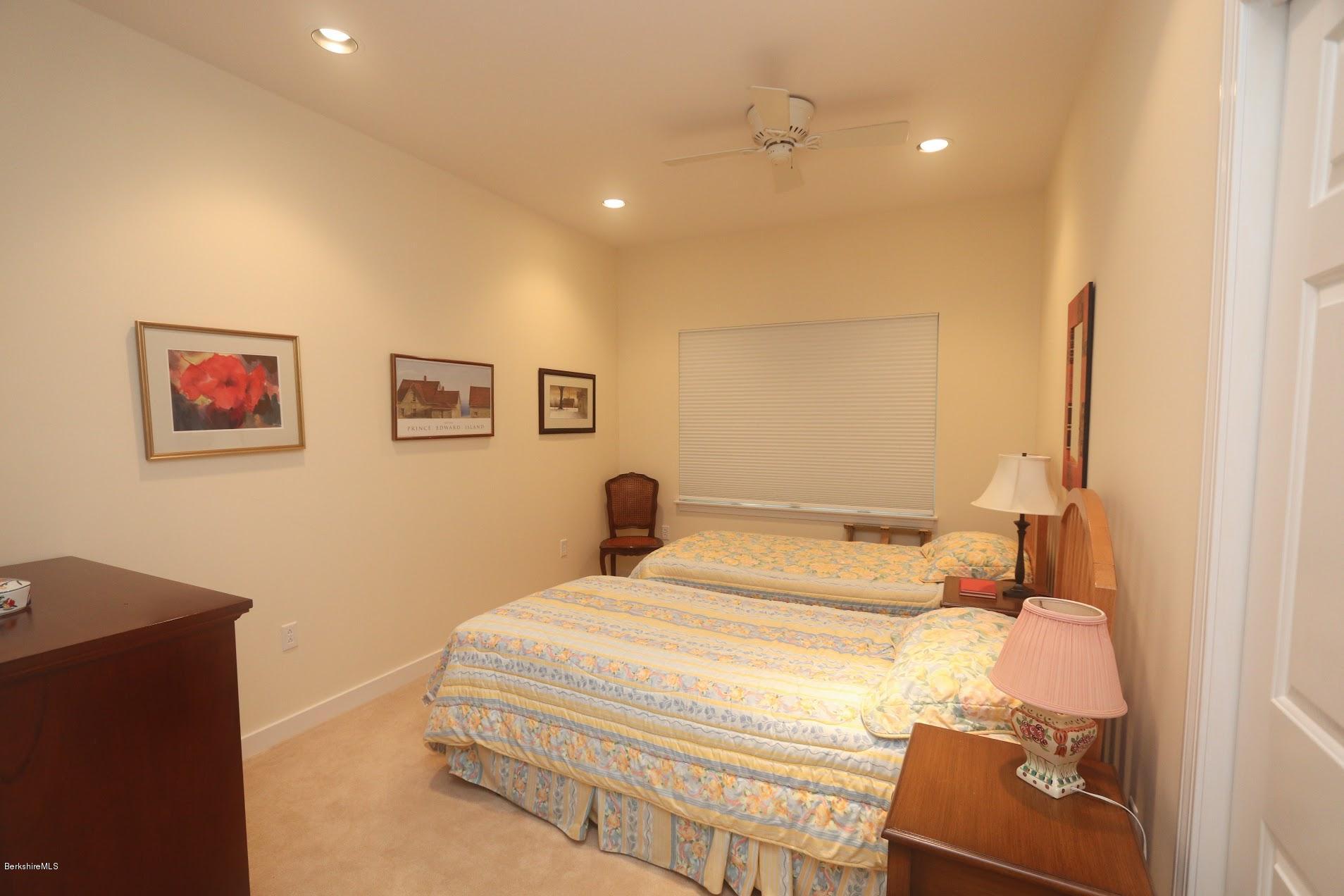 11 Prospect Hill Road, Unit 2 Stockbridge, MA 01262 - Photo 27 of 53 a bedroom with a bed and a lamp