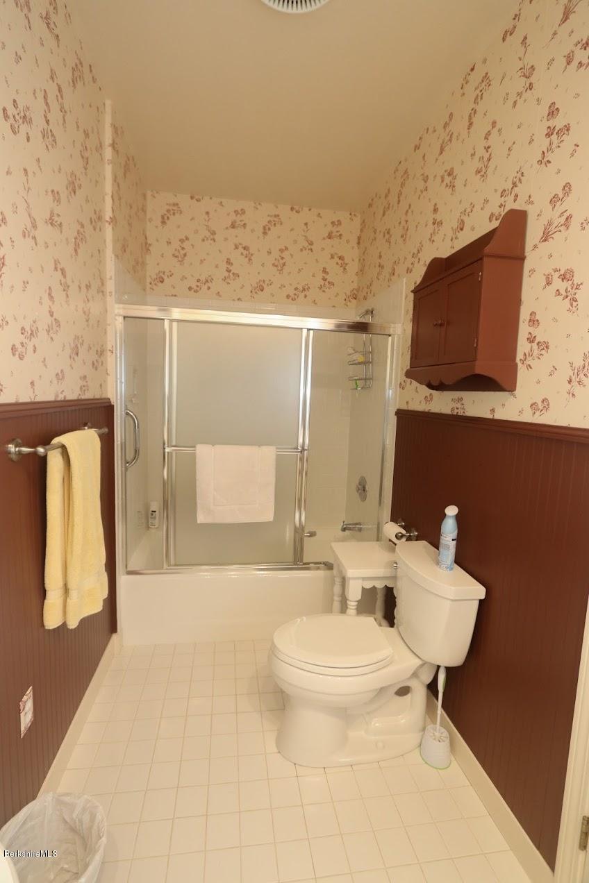 11 Prospect Hill Road, Unit 2 Stockbridge, MA 01262 - Photo 28 of 53 a bathroom with a toilet sink and mirror
