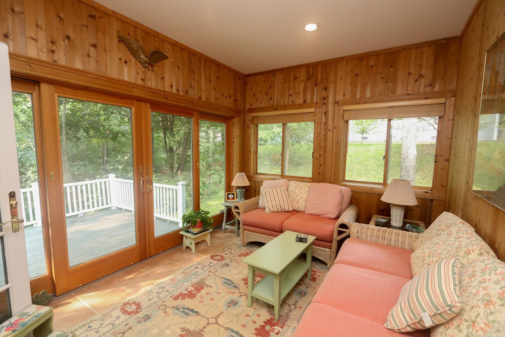 11 Prospect Hill Road, Unit 2 Stockbridge, MA 01262 - Photo 30 of 53 a living room with furniture and large windows