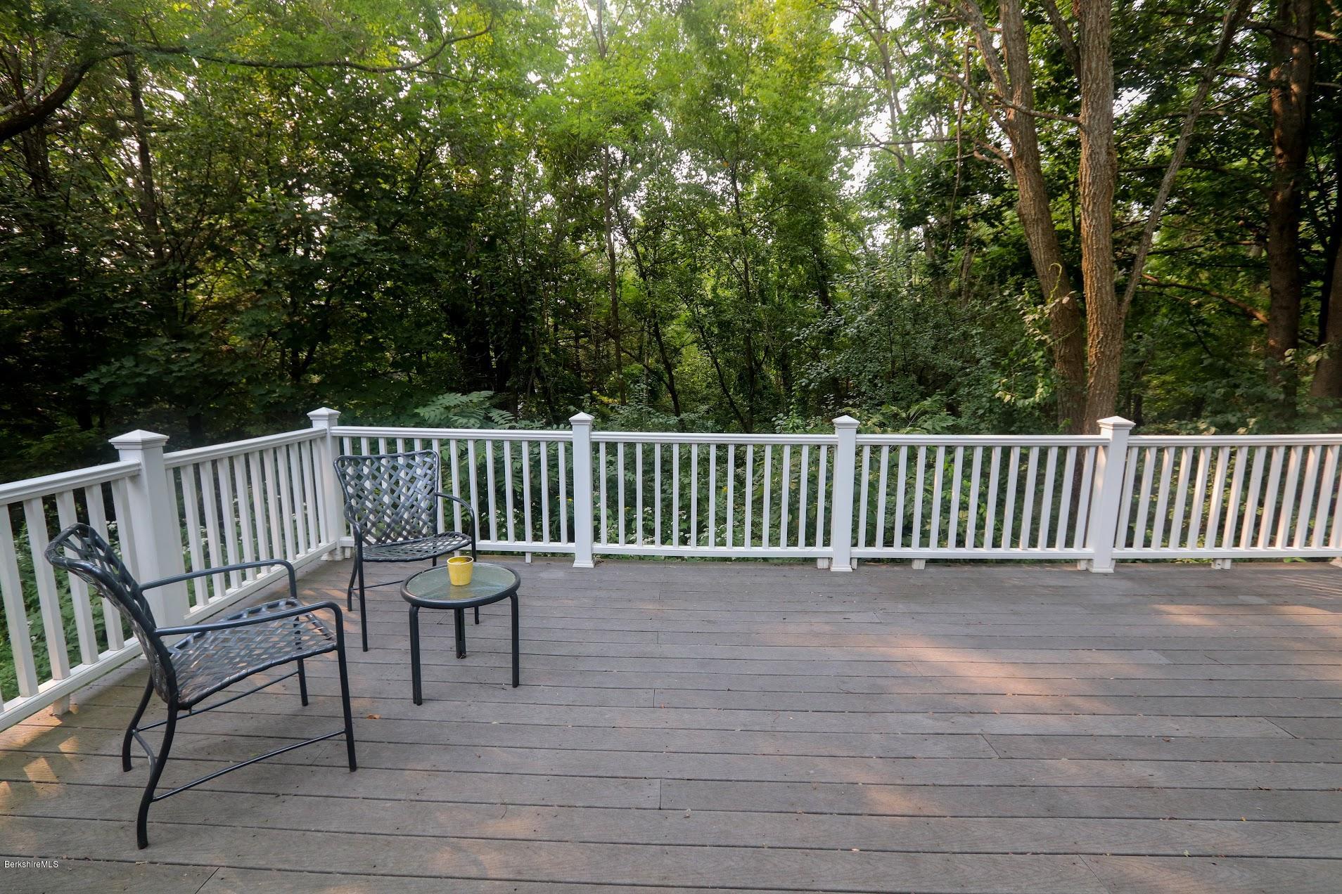 11 Prospect Hill Road, Unit 2 Stockbridge, MA 01262 - Photo 32 of 53 a view of a chair and table on the wooden floor