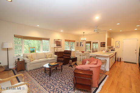 11 Prospect Hill Road, Unit 2 Stockbridge, MA 01262 - Photo 6 of 53 a living room with furniture a wooden floor and a large window