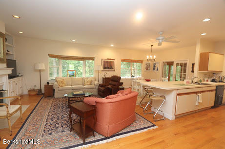 11 Prospect Hill Road, Unit 2 Stockbridge, MA 01262 - Photo 7 of 53 a living room with stainless steel appliances furniture and a kitchen view