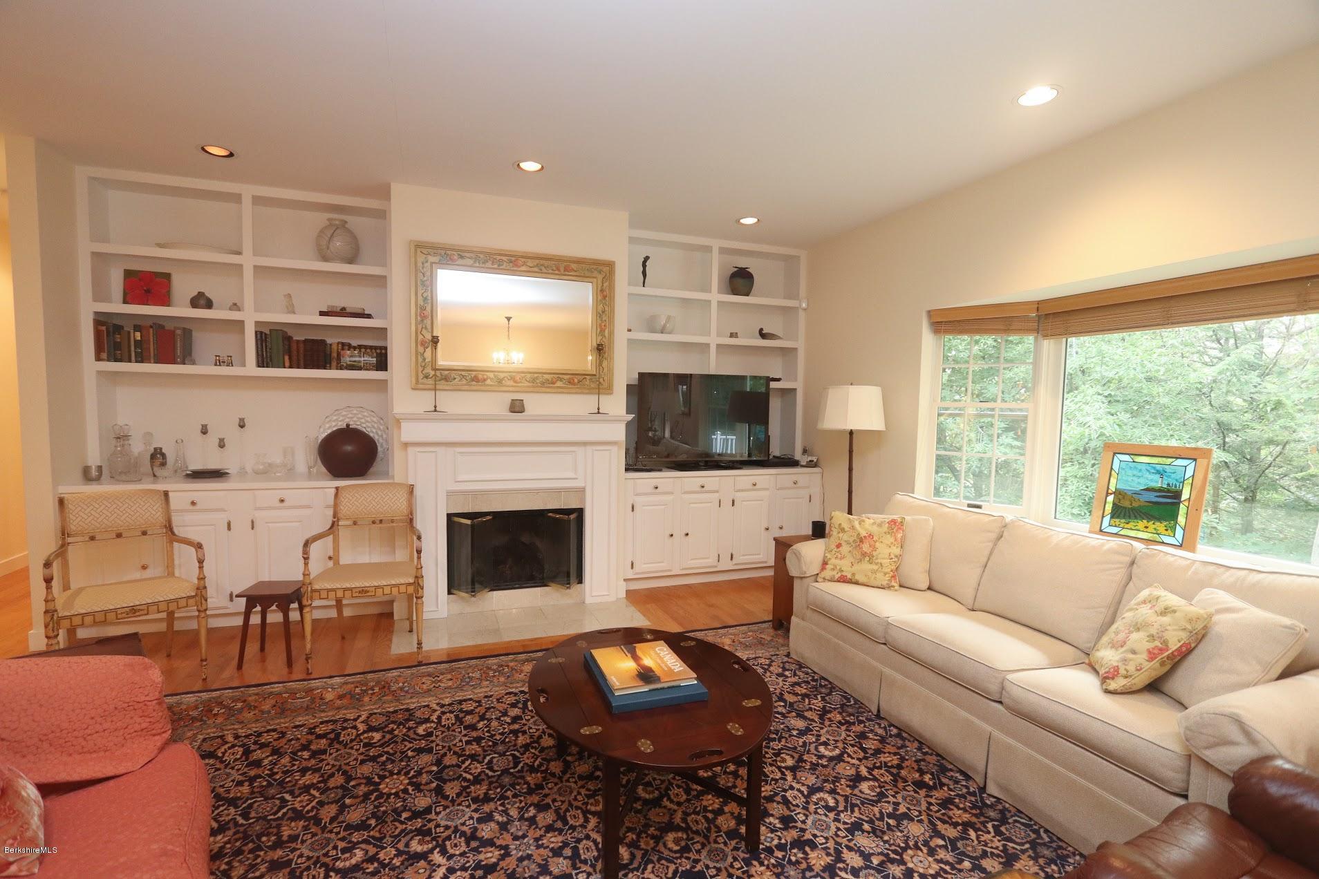 11 Prospect Hill Road, Unit 2 Stockbridge, MA 01262 - Photo 8 of 53 a living room with furniture fireplace and window