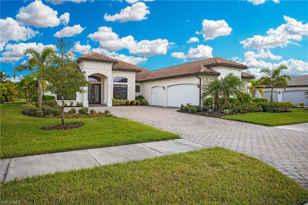 2247 Somerset Place Naples, FL 34120 - Photo 2 of 35 a front view of a house with garden