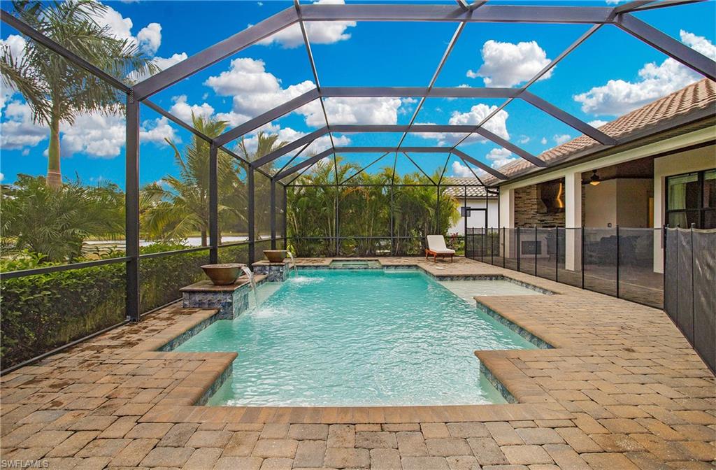 2247 Somerset Place Naples, FL 34120 - Photo 28 of 35 a view of a backyard with a patio