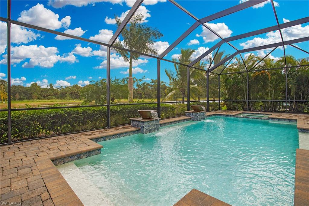 2247 Somerset Place Naples, FL 34120 - Photo 29 of 35 a view of a swimming pool with a patio