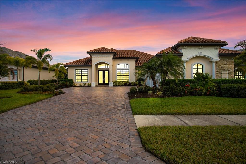 2247 Somerset Place Naples, FL 34120 - Photo 30 of 35 a front view of a house with a yard