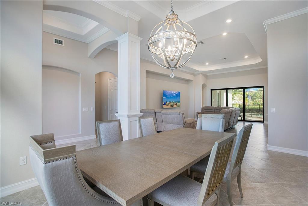 2247 Somerset Place Naples, FL 34120 - Photo 3 of 35 a view of a dining room with furniture