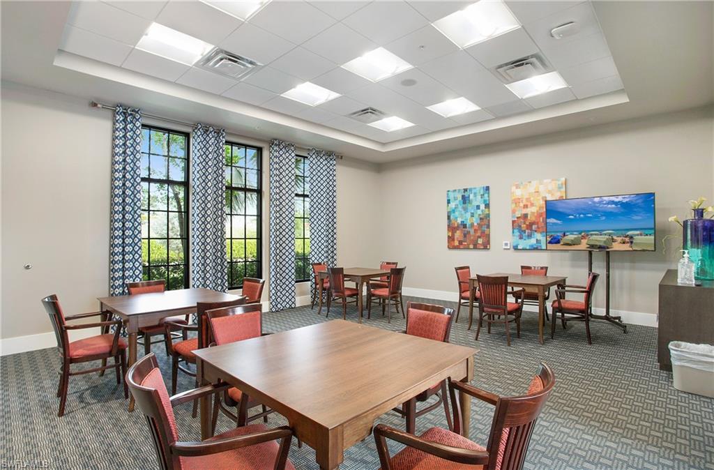 2247 Somerset Place Naples, FL 34120 - Photo 35 of 35 a view of a dining room with furniture window and outside view