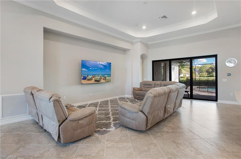 2247 Somerset Place Naples, FL 34120 - Photo 6 of 35 a living room with furniture and a view of kitchen