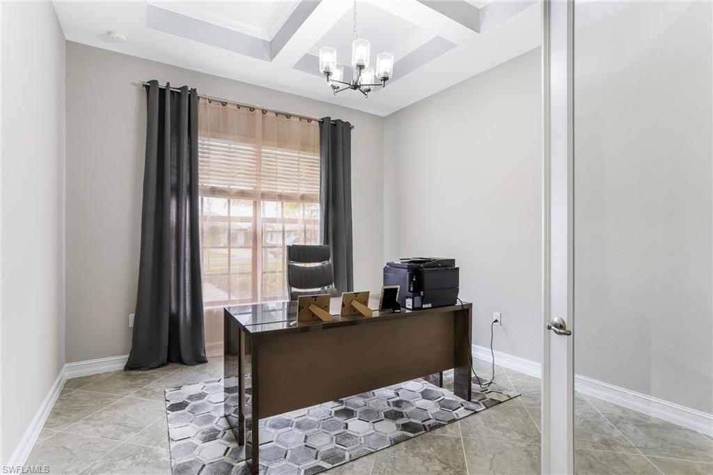 2247 Somerset Place Naples, FL 34120 - Photo 7 of 35 a living room with furniture and window